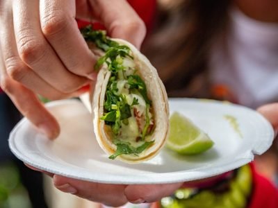 closeup-shot-of-a-person-eating-vegan-tacos-with-l-2023-11-27-05-35-00-utc-scaled.jpeg